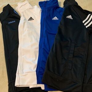 4 sweatshirts in good condition only white one has a stain